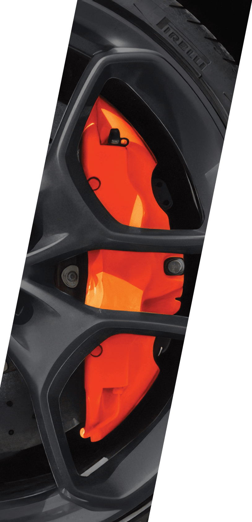 A black wheel with orange trim and a silver center. AI generated content